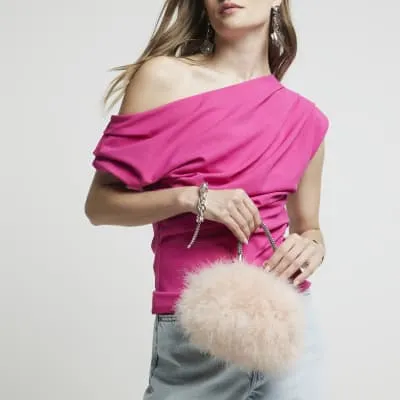 Pink feather clip top cross body bag sold by River Island