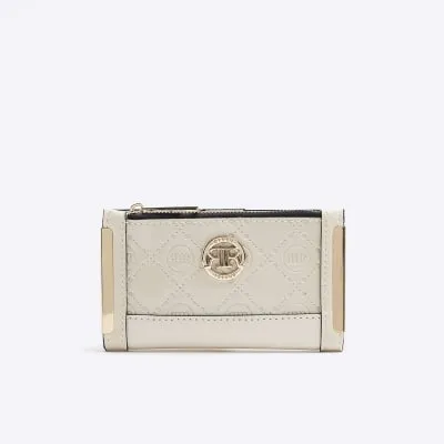 Cream embossed mini purse sold by River Island