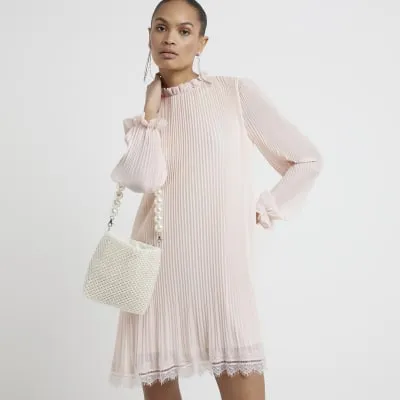 Pink plisse lace hem shift mini dress sold by River Island