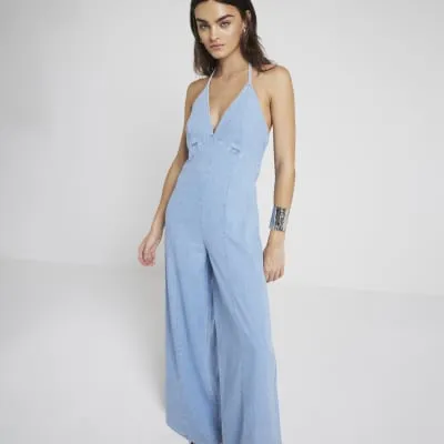 Blue denim halter neck wide leg jumpsuit sold by River Island