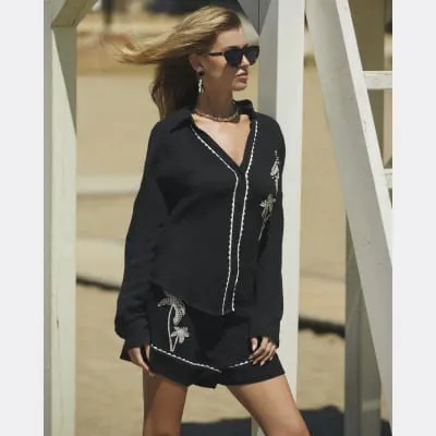 Black embroidered palm tree shirt sold by River Island