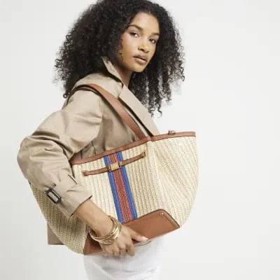 Beige straw winged tote bag sold by River Island