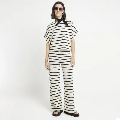 Black crochet stripe short sleeve top sold by River Island