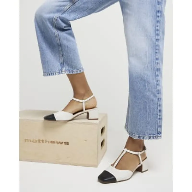 White block heeled court shoes sold by River Island