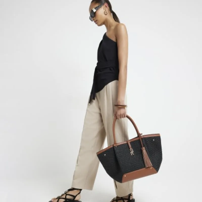 Black raffia large tote bag sold by River Island