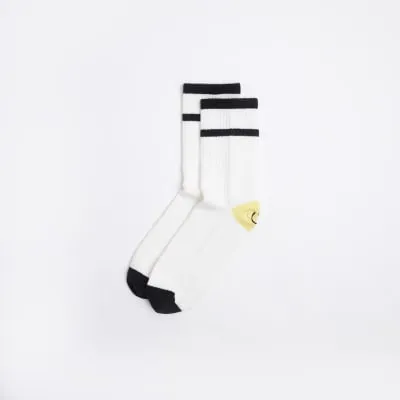 White graphic print smiley socks sold by River Island