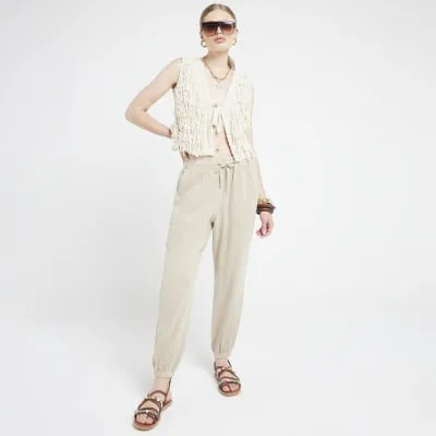 Beige lyocell elasticated joggers sold by River Island