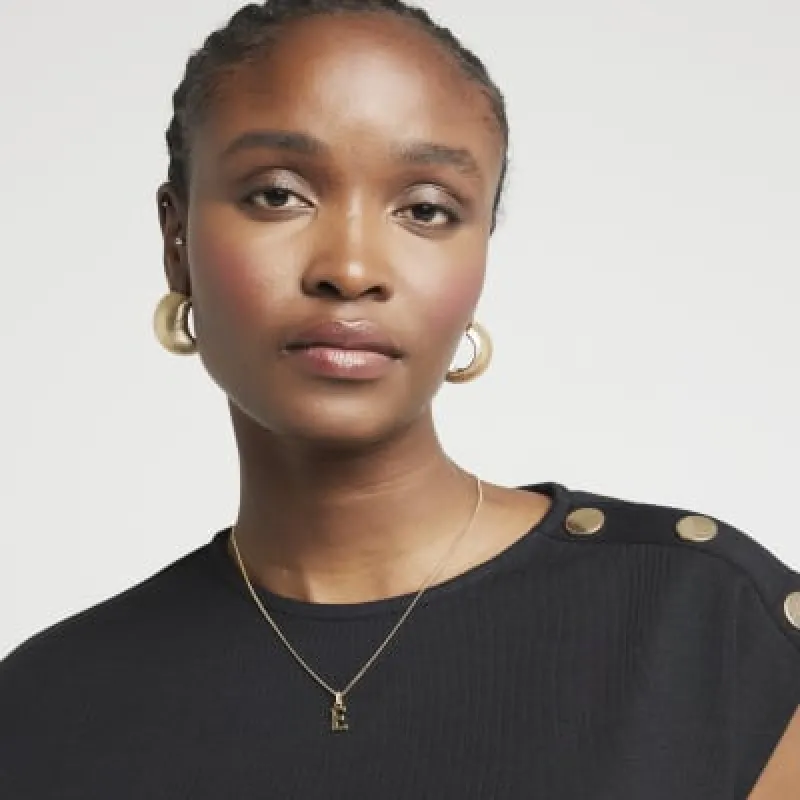 Gold Plated E Initial Necklace sold by River Island