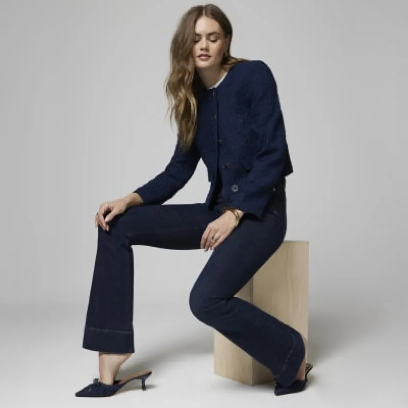 Blue high waisted tummy hold flared jeans sold by River Island