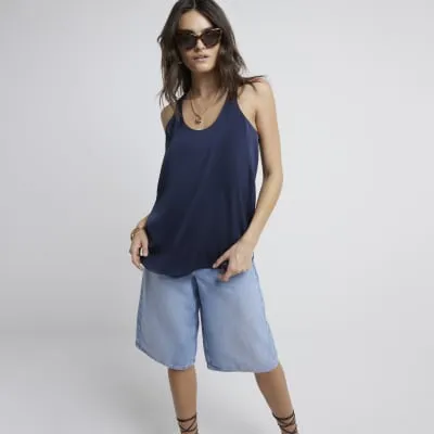 Navy scoop neck tank top sold by River Island