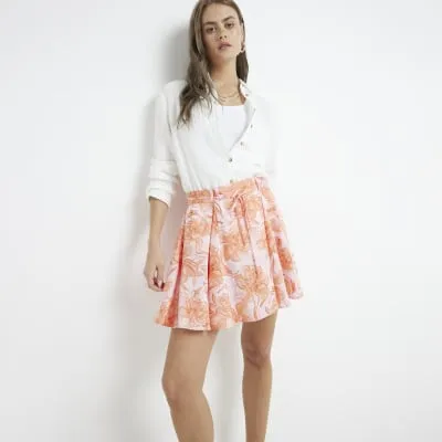 Pink floral tie waist mini skirt sold by River Island