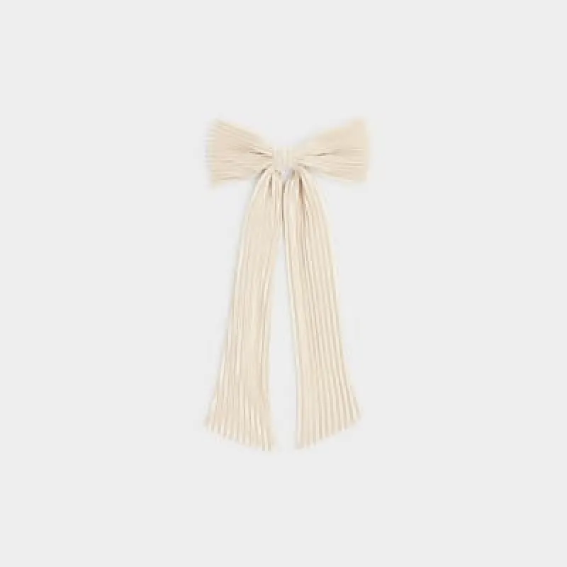 White plisse bow hair clip sold by River Island