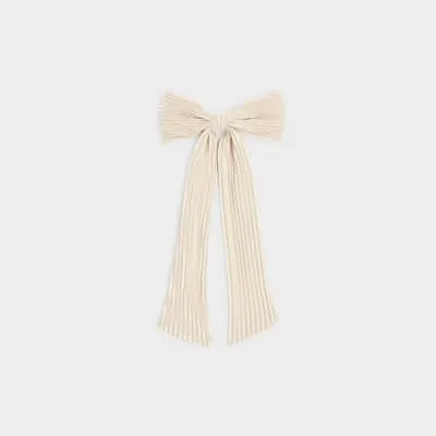 White plisse bow hair clip sold by River Island