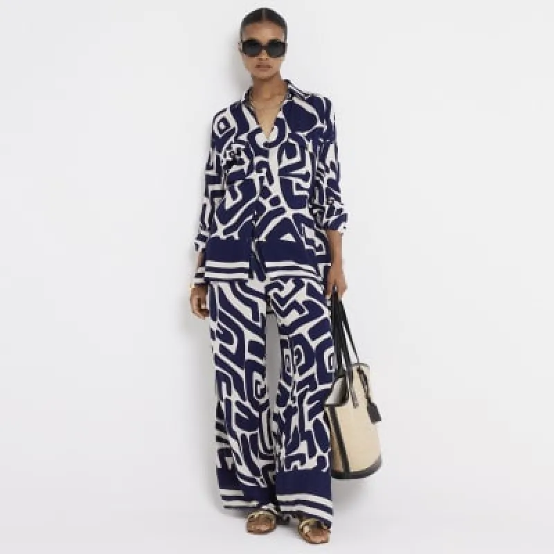 Navy abstract wide leg beach trousers sold by River Island