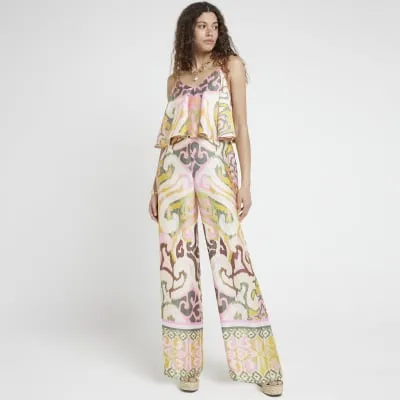 Pink satin abstract layered jumpsuit sold by River Island