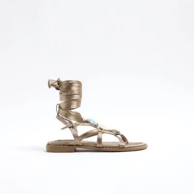Beige embellished tie up sandals sold by River Island