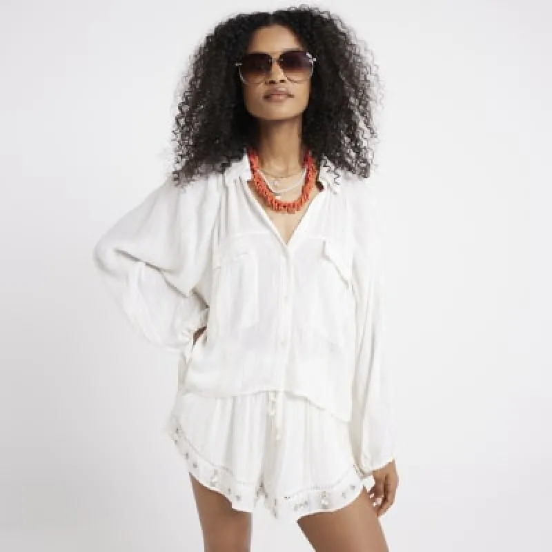 Cream glitter tie cuff beach shirt sold by River Island