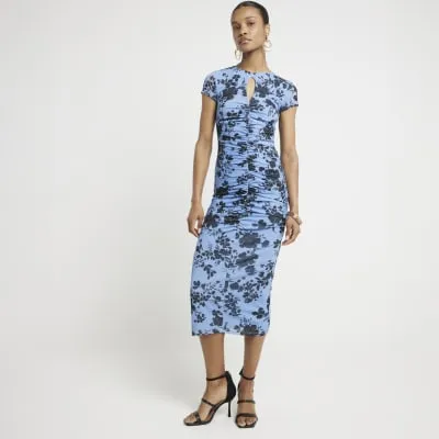 Blue ruched floral bodycon midi dress sold by River Island