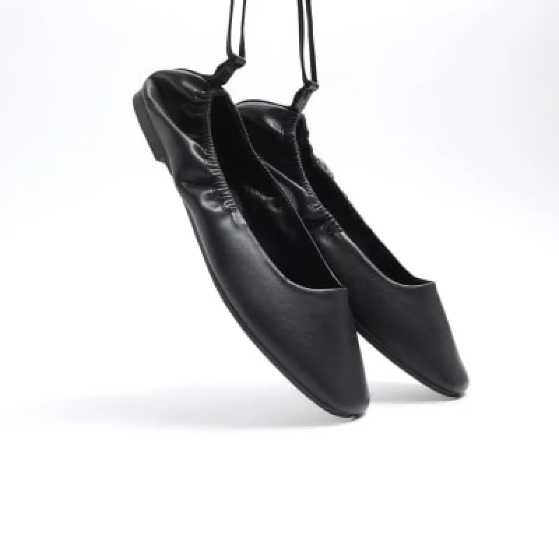 Black tie up ballet pumps sold by River Island