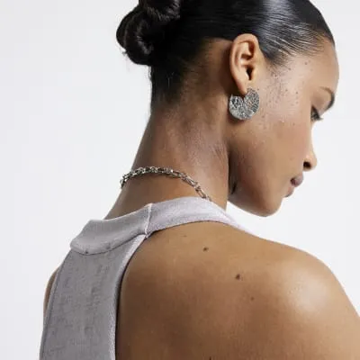 Silver colour textured hoop earrings sold by River Island