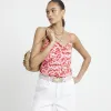 Red floral cowl neck cami top sold by River Island
