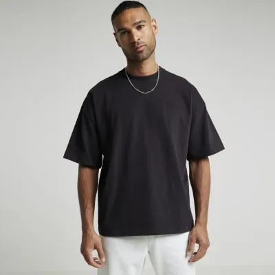 Black oversized embossed print t-shirt sold by River Island