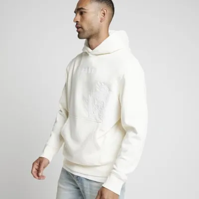 Beige regular fit japanese embroidered hoodie sold by River Island