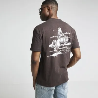 Brown regular fit cowboy graphic t-shirt sold by River Island