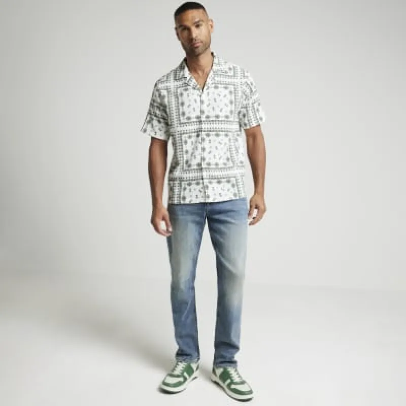 Beige regular crinkle graphic revere shirt sold by River Island
