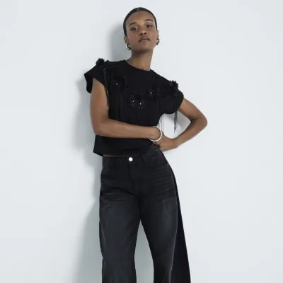 Black embellished floral tassel t-shirt sold by River Island