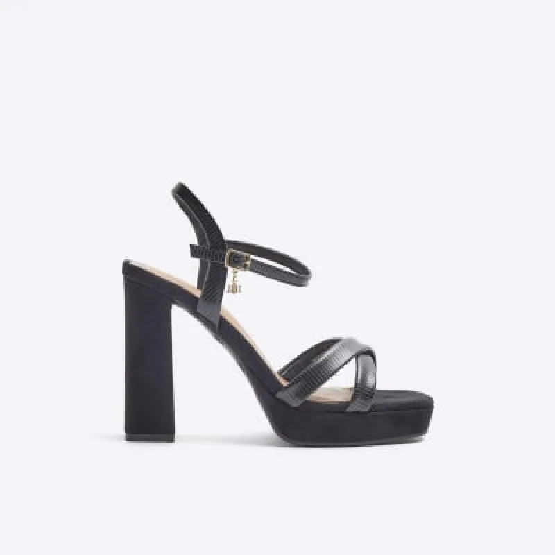 Black wide fit crossed strap heeled sandals sold by River Island