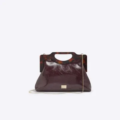 Red tortoiseshell handle clutch bag sold by River Island