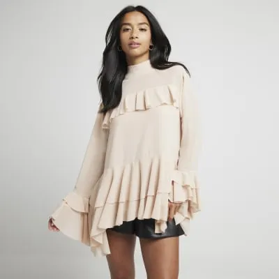 Petite pink frill blouse sold by River Island
