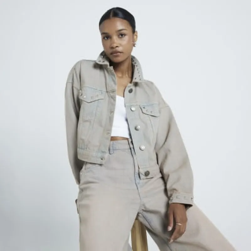 Grey studded denim jacket sold by River Island