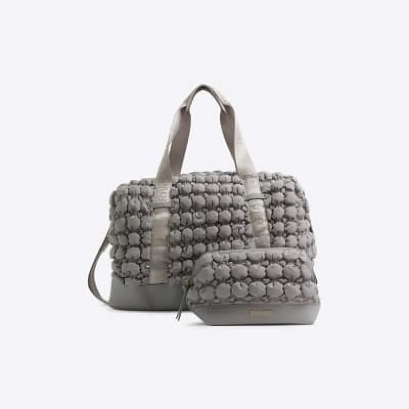 Grey quilted texture travel and makeup bag sold by River Island