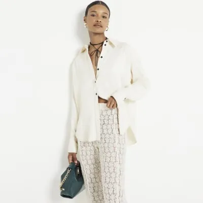 Cream premium satin oversized shirt sold by River Island