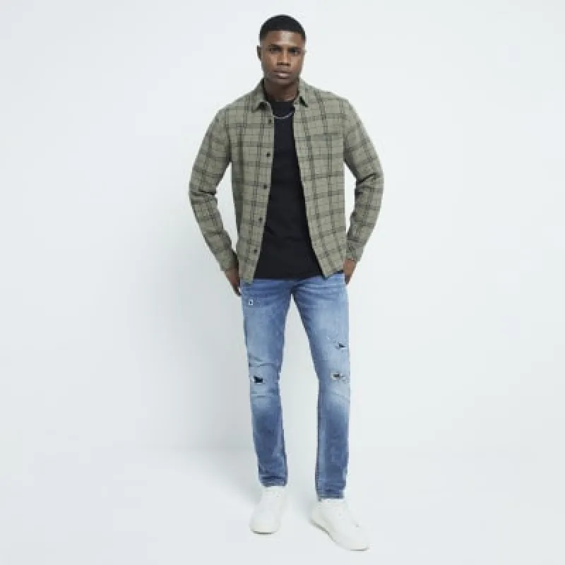 Blue ripped skinny jeans made by River Island