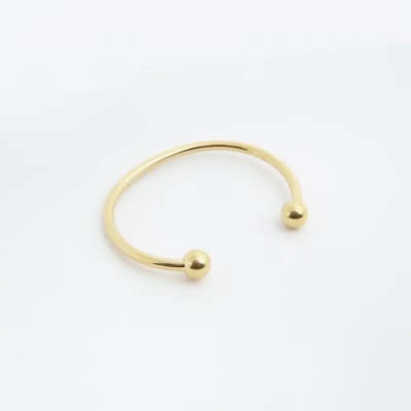 Gold colour stainless steel bracelet sold by River Island