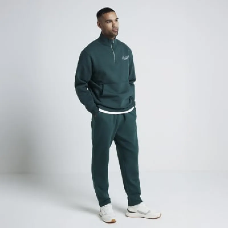Green regular fit graphic half zip sweatshirt sold by River Island