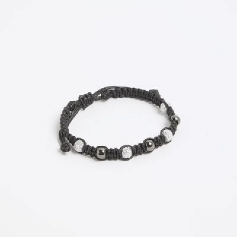 Black beaded tie up bracelet sold by River Island