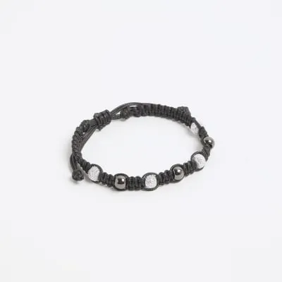 Black beaded tie up bracelet sold by River Island