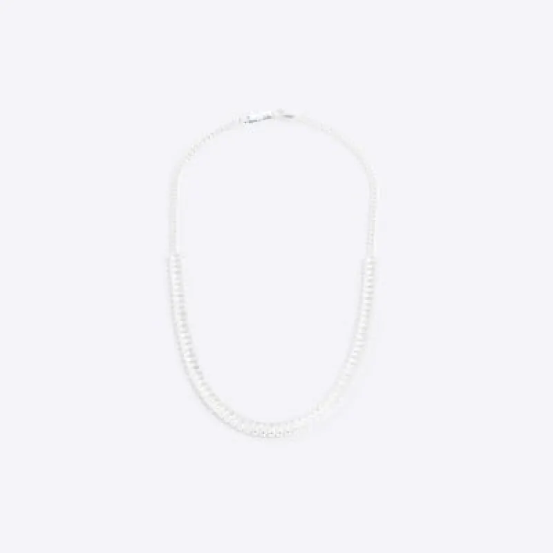 Silver colour textured necklace sold by River Island