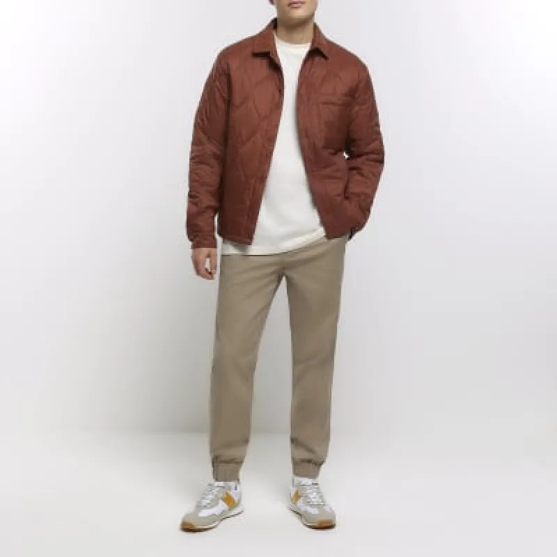 Beige regular fit pull on cuffed trousers sold by River Island