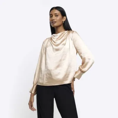 Beige satin cowl neck blouse sold by River Island