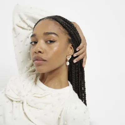 Gold Ribbed Heart Pearl Drop Earrings sold by River Island