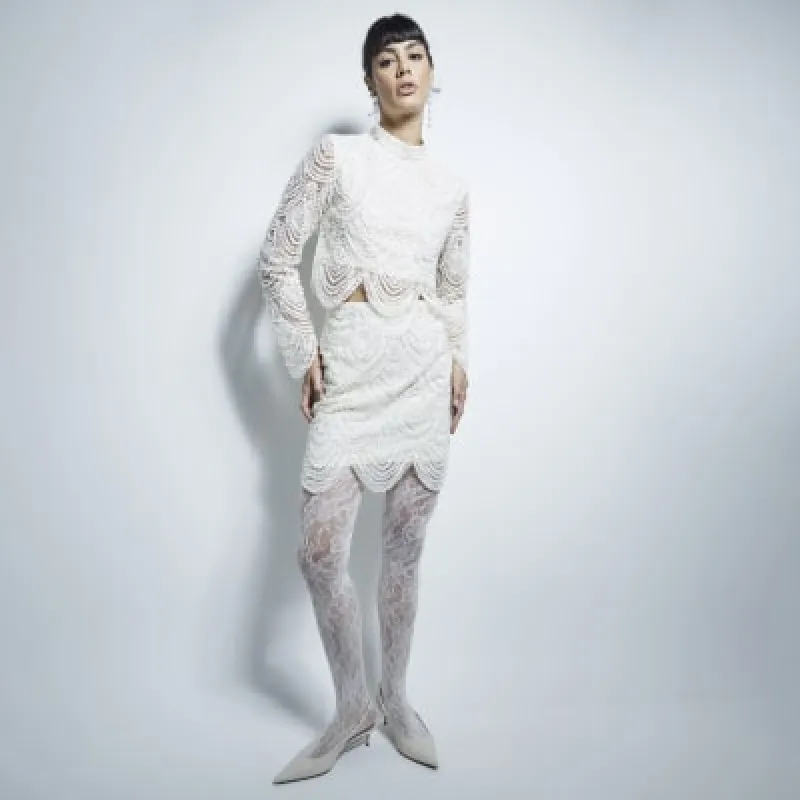 Cream Scalloped Pearl mini Skirt sold by River Island