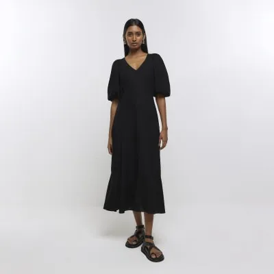 Black puff sleeve smock midi dress with linen sold by River Island