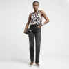 Cream satin floral halter neck top sold by River Island