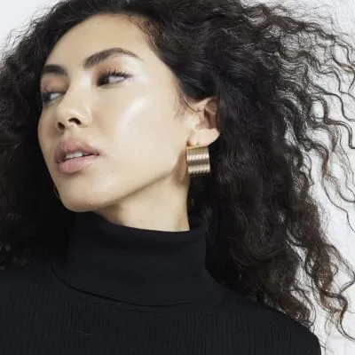 Gold Ribbed Wide Hoops Earrings sold by River Island