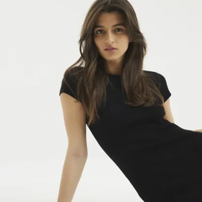 Black Cap Sleeve Ribbed Midi Dress sold by River Island